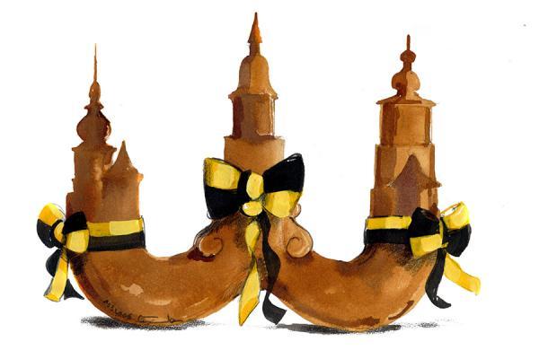 Eine braune Horaffenform, wobei die drei Spitzen die Formen von einigen Türmen der Stadt haben und mit einer gelb-schwarzen Schleife umwickelt sind.
