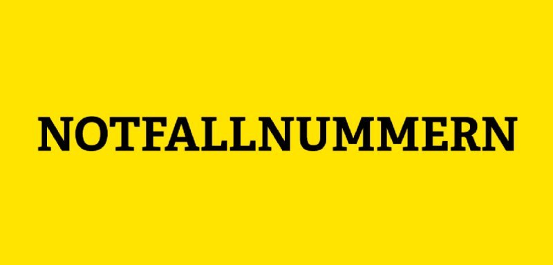 Gelbe Kachel mit der Aufschrift Notfallnummern